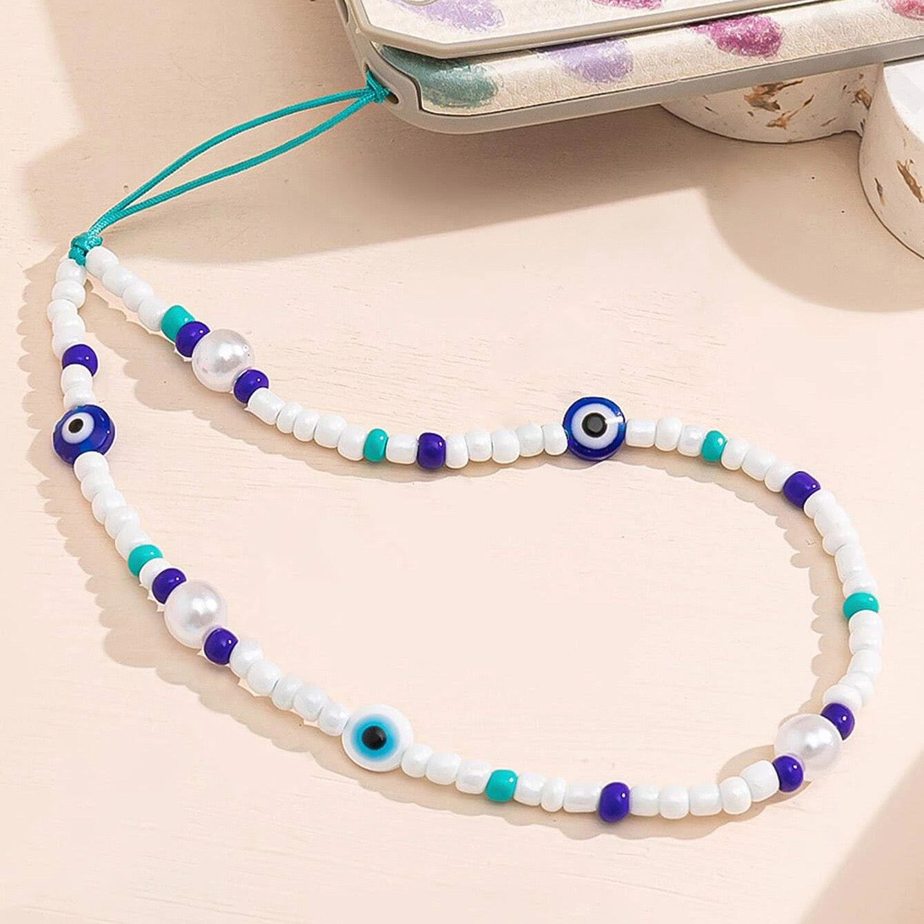 Evil eye blue phone charm